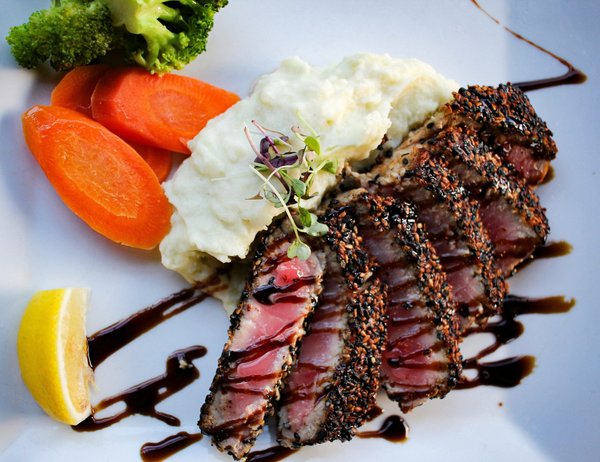 What Techniques Ensure a Perfectly Seared Gourmet Ahi Tuna with Sesame Seeds?